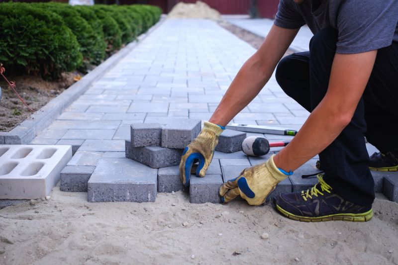 Paver installation in a landscaped yard